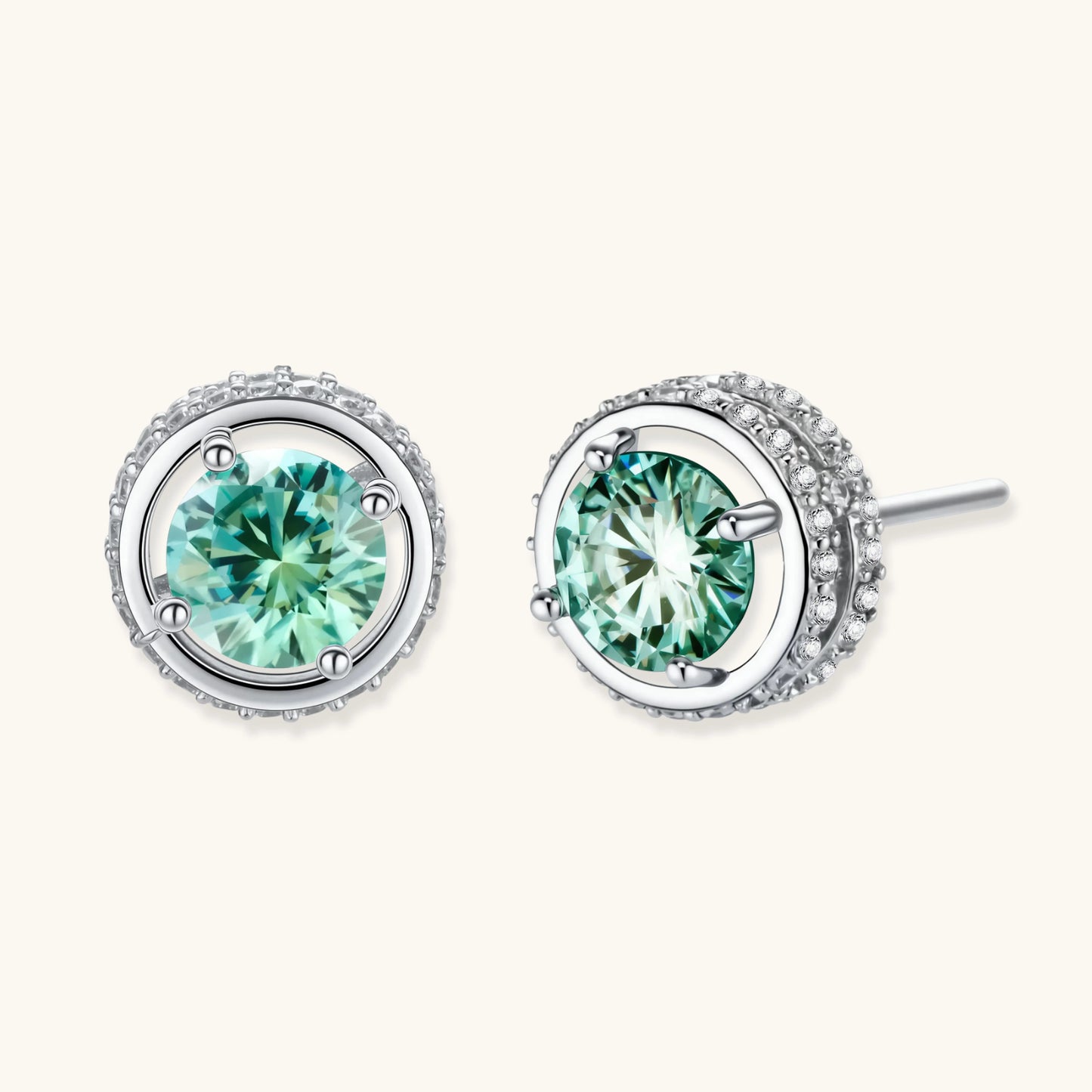 Round green moissanite stud earrings in sterling silver halo settings with brilliant sparkle on white background.